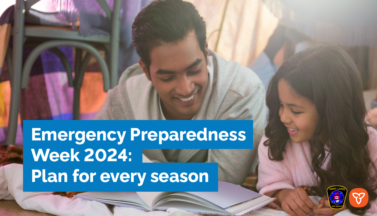 Father and daughter laying on ground smiling while looking at a book. Text reads: Emergency preparedness week 2024: Plan for every season. 