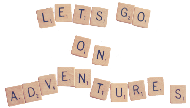 Scrabble letter tiles spelling out Lets go on adventures