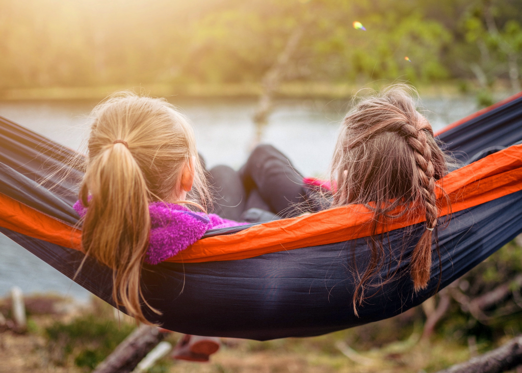 young girls relaxing on a hammock